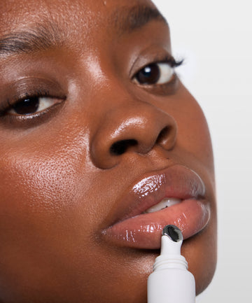 | desc: Model wears Lip Gloss in Clear