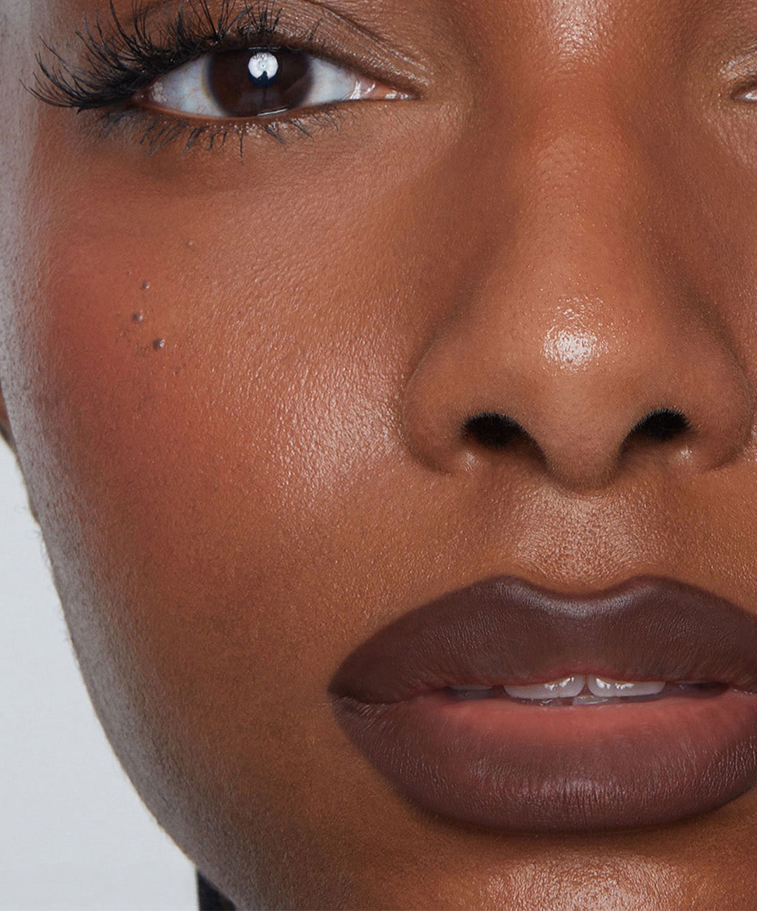 | desc: Model wears Lip Sculpt in shade Suede